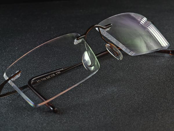 Pair of eye glasses with an anti-reflective coating showing the reflex-color green